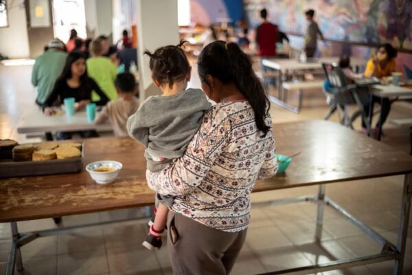 The Trump administration stops funds for legal assistance for migrant children Photo: Migrants and Asylum Seekers Wait in Line To Receive Lunch at the House of Mercy and all Nations Migrant Shelter, In Nogales, Sonora, Mexico, Feb. 23, 2025.